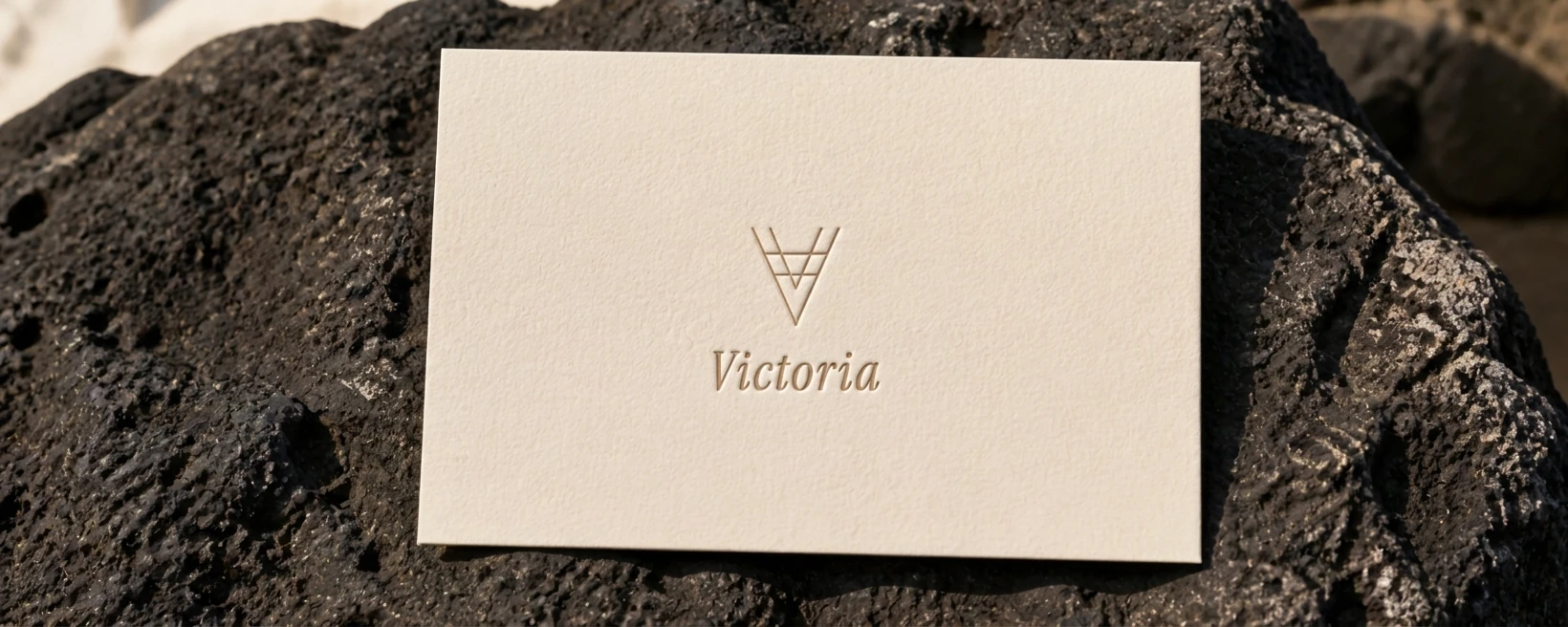 Victoria welcome card placed in volcanic-stone dish at reception